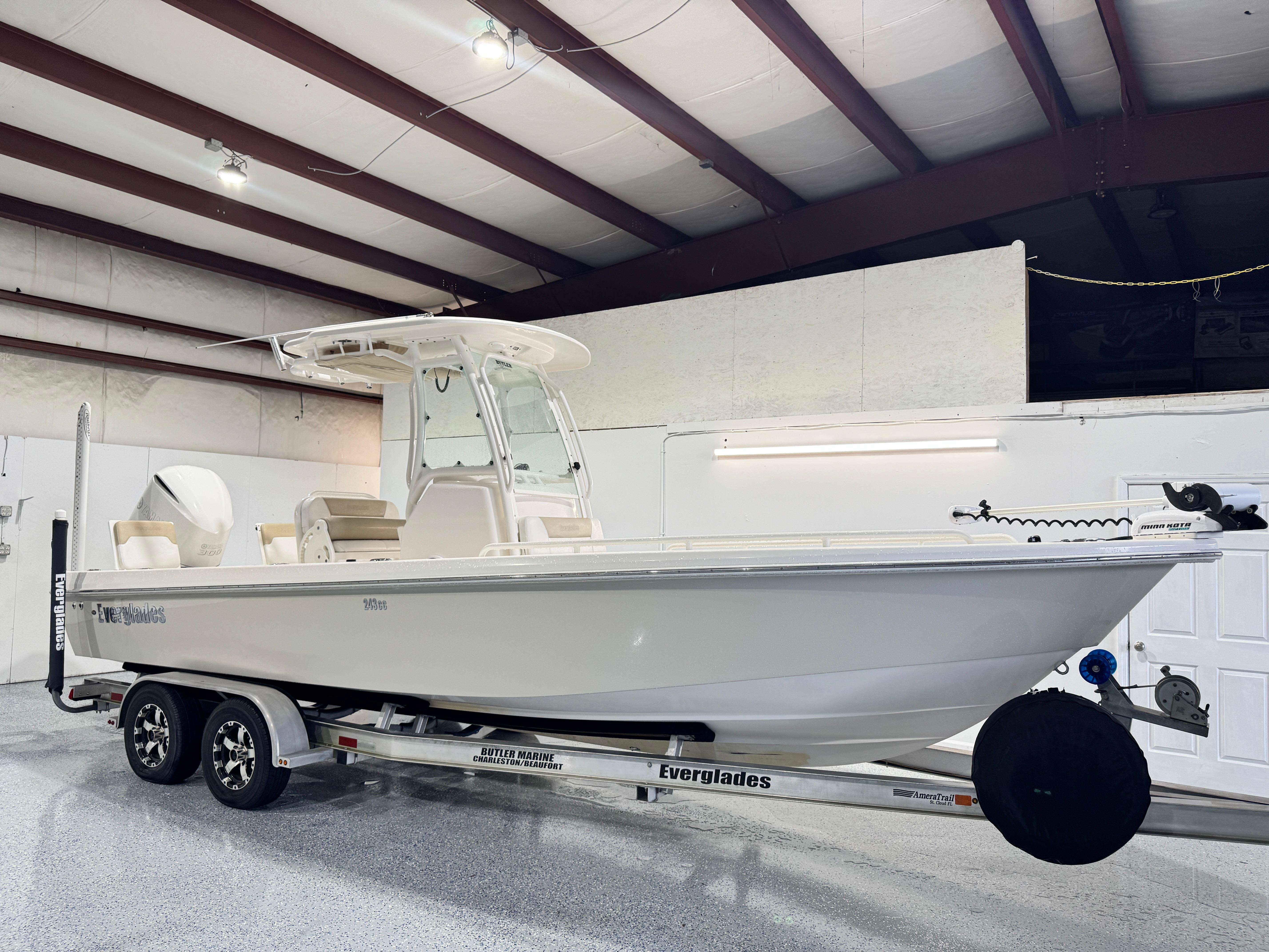 Everglades 243 CC 2014 Everglades 243 CC boat on trailer in indoor storage facility.