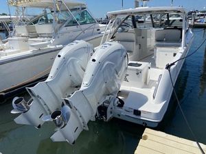 Everglades 340 Dual Console 2019 Everglades 340 Dual Console boat docked with twin outboard engines.