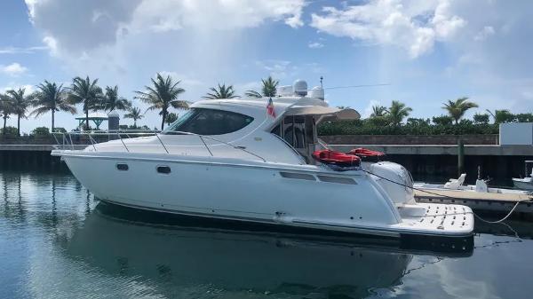 Tiara Yachts 4500 Sovran 2011 Tiara Yachts 4500 Sovran docked, with palm trees and blue sky in the background.