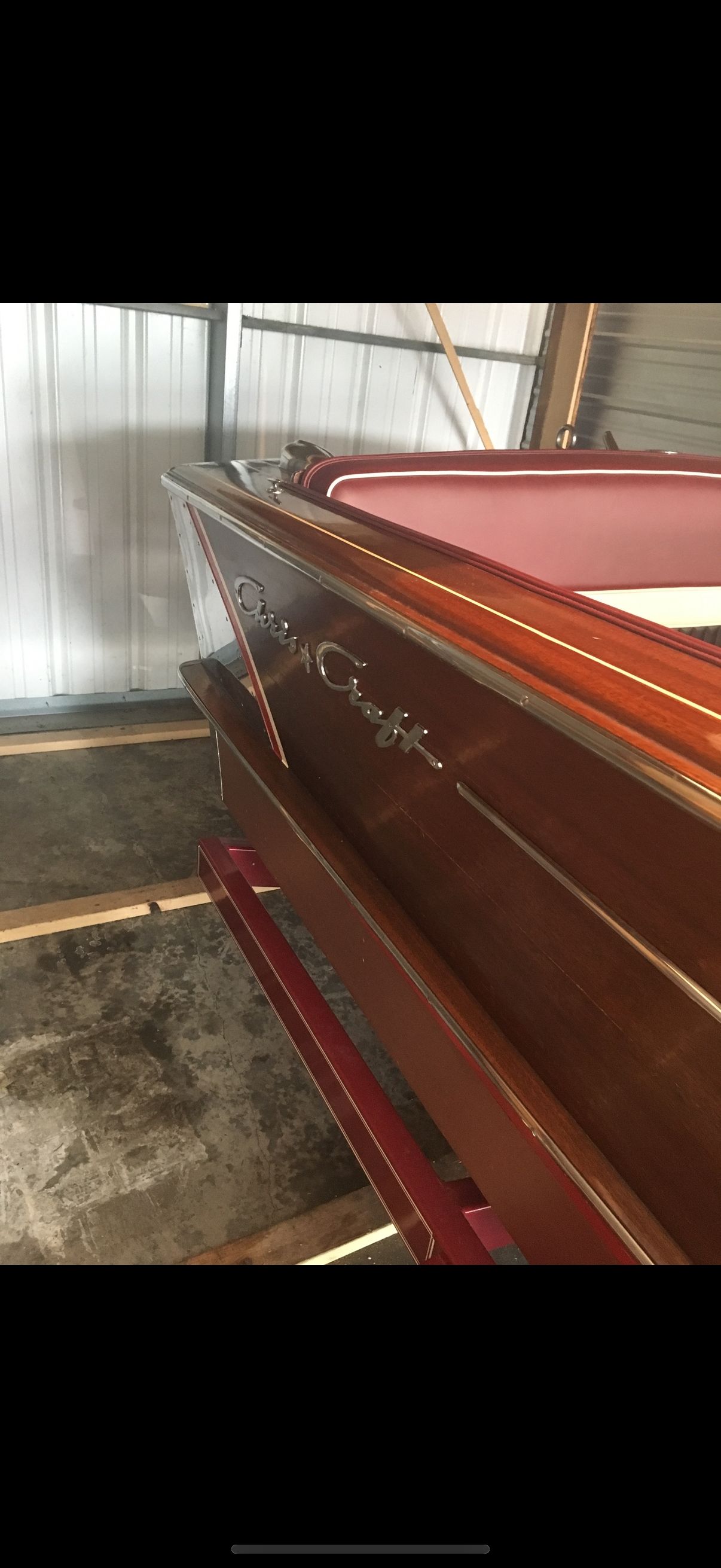 Chris-Craft Continental 1960 Chris-Craft Continental boat with wooden finish in storage.
