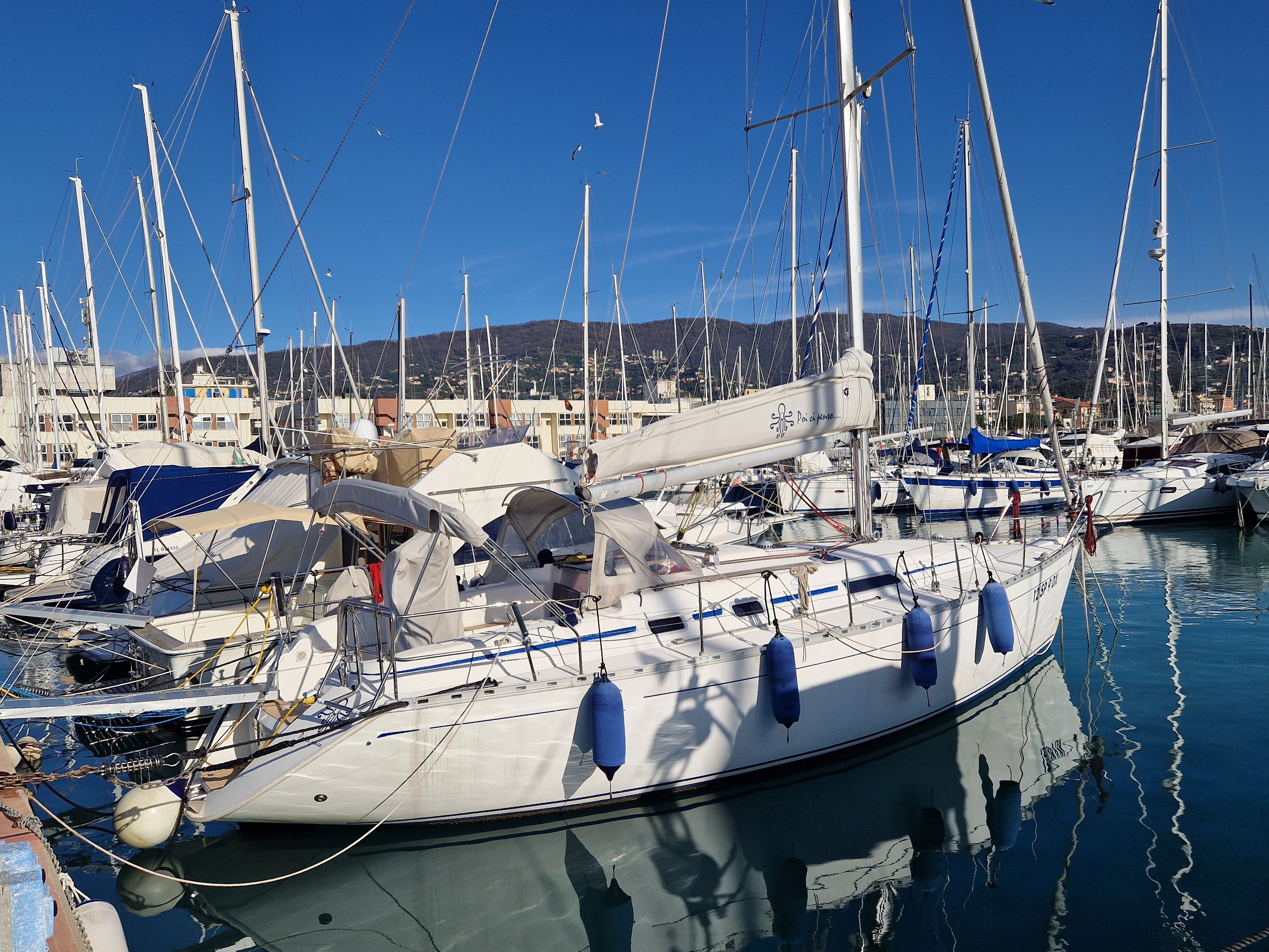 Dufour 36 Classic Dufour 36 Classic 2001 sailboat docked in a marina under clear blue skies.