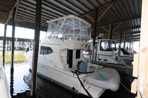 Silverton 34 Convertible 2005 Silverton 34 Convertible yacht docked in covered marina.