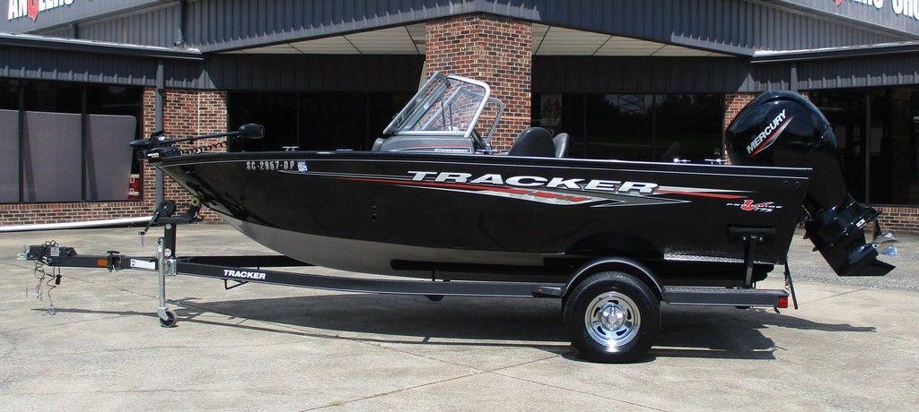 Tracker Pro Guide V-175 Combo 2020 Tracker Pro Guide V-175 Combo boat on trailer, parked outside a building.