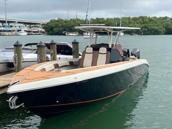 Statement 350 Open 2021 Statement 350 Open boat docked on calm water, featuring sleek design and modern amenities.