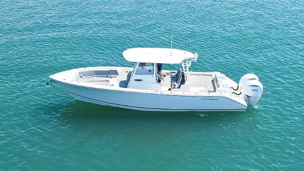 Cobia 320 Center Console 2024 Cobia 320 Center Console boat on clear blue water.