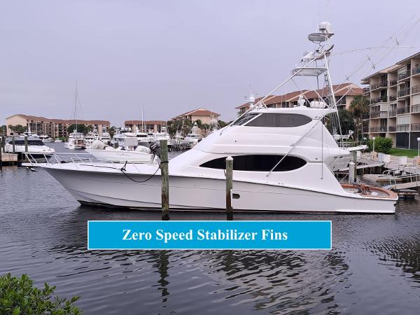 Hatteras 68 Convertible 2006 Hatteras 68 Convertible yacht docked, featuring zero speed stabilizer fins.