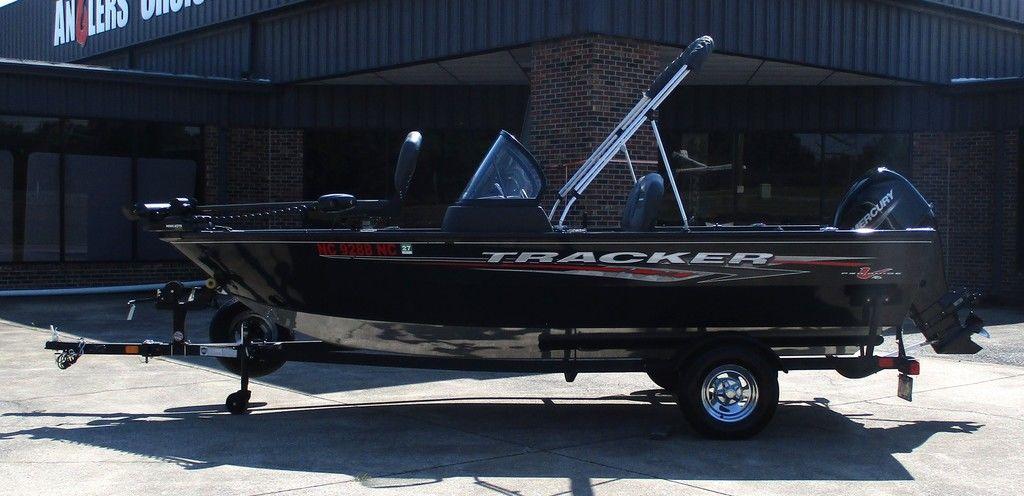 Tracker Pro Guide V-16 WT 2024 Tracker Pro Guide™ V-16 WT boat on trailer outside dealership.
