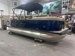 Sylvan Mirage Fish 820 Party Fish 2025 Sylvan Mirage Fish 820 Party Fish pontoon boat in a workshop setting.