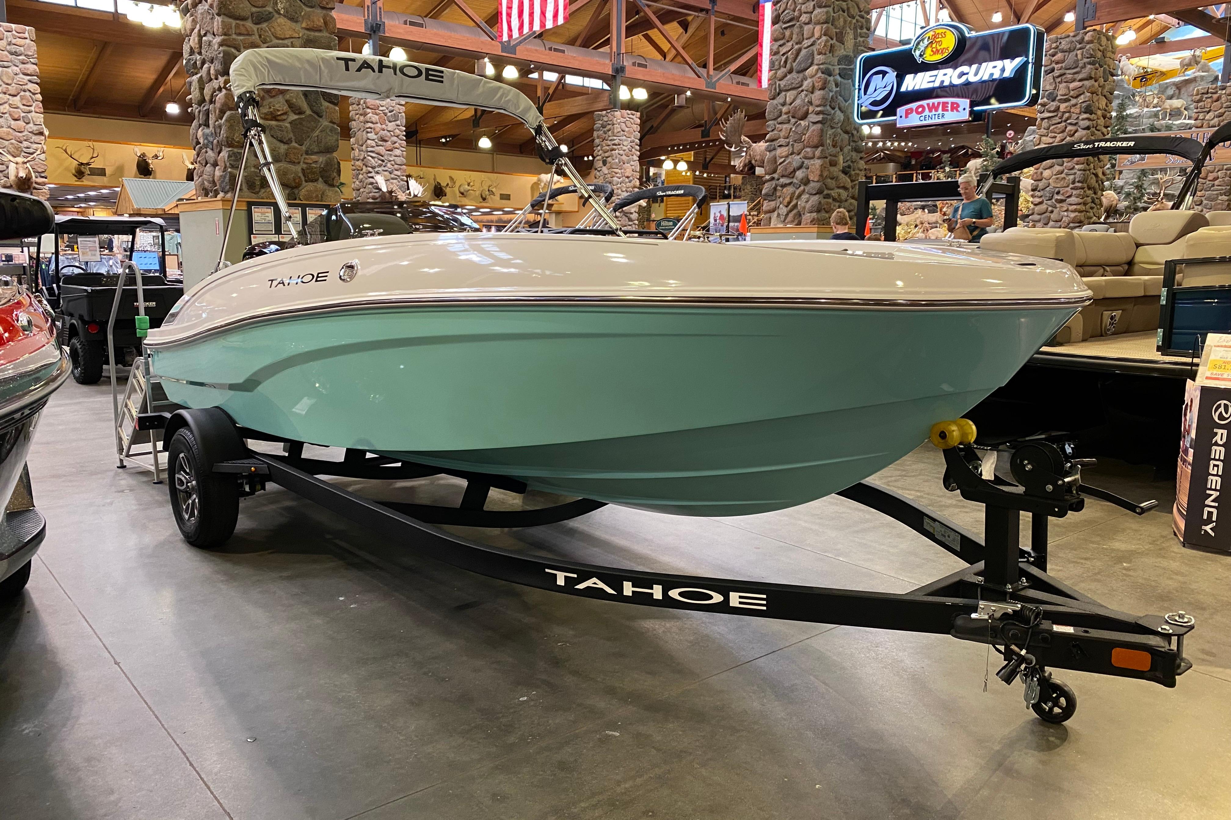 Tahoe T18 2026 Tahoe T18 boat displayed indoors, featuring a sleek design and light blue hull.
