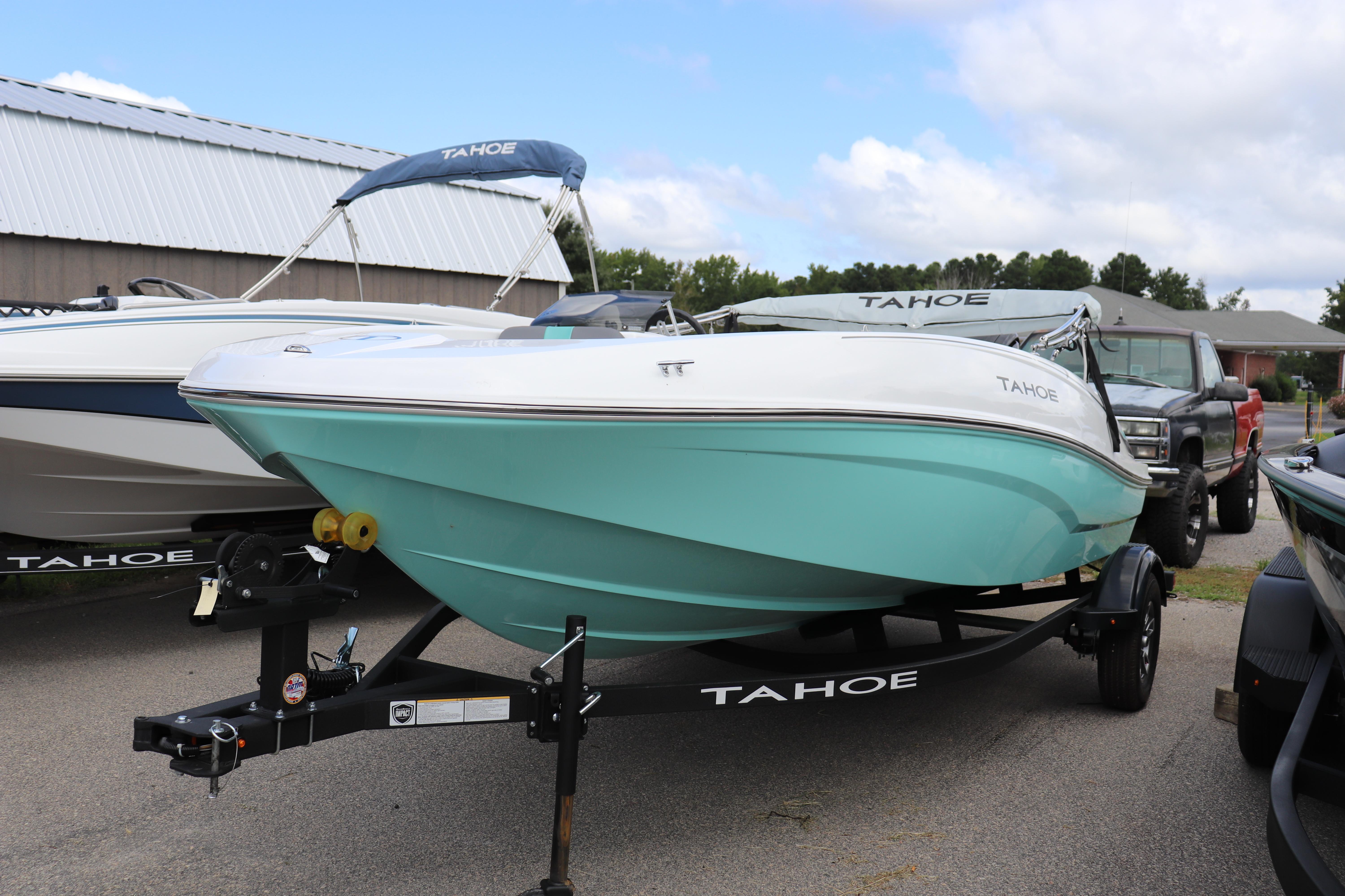 Tahoe T16 2026 Tahoe T16 boat on trailer, turquoise hull, parked outdoors.