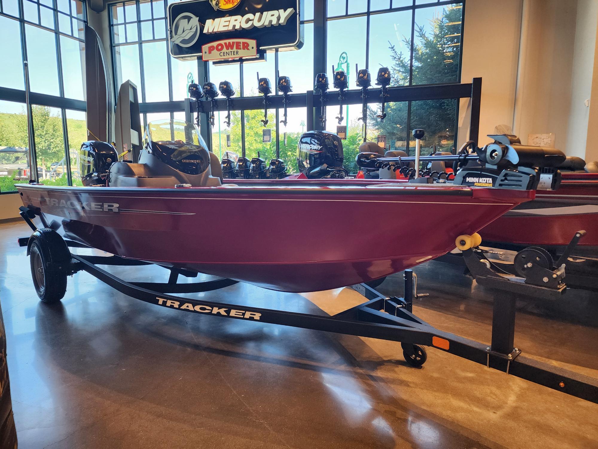 Tracker Super Guide V-16 SC 2025 Tracker Super Guide V-16 SC boat displayed indoors with Mercury engine.