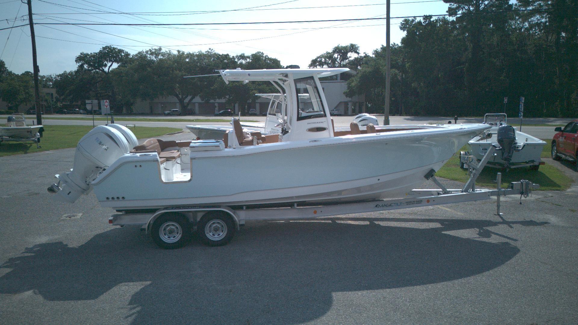 Sea Hunt Ultra 275 SE 2026 Sea Hunt Ultra 275 SE boat on trailer, parked outdoors.