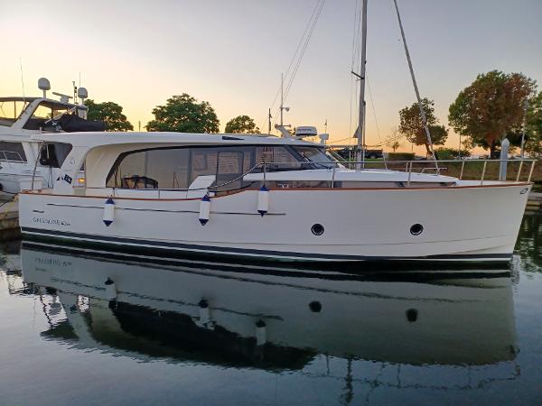 Greenline 40 2020 Greenline 40 yacht docked at sunset, reflecting on calm water.