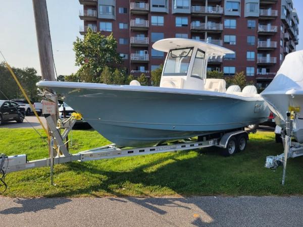 Sea Hunt Ultra 275 SE 2024 Sea Hunt Ultra 275 SE boat on a trailer in a residential area.