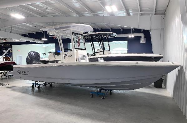 Robalo 246 Cayman 2024 Robalo 246 Cayman boat displayed in a showroom.