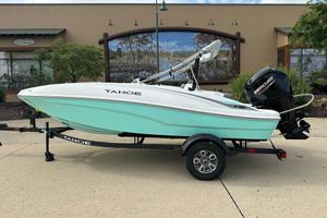Tahoe T16 2026 Tahoe T16 boat on trailer, mint green hull, Mercury outboard motor.