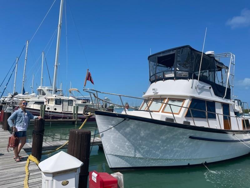 Monk 36 1984 Monk 36 boat docked at marina under clear blue sky.