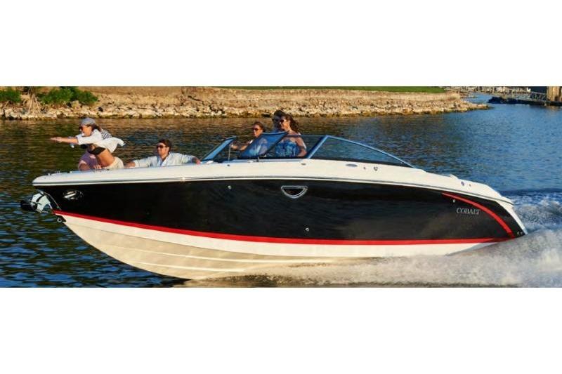 Cobalt R30 2017 Cobalt R30 boat cruising on a lake with passengers enjoying the ride.