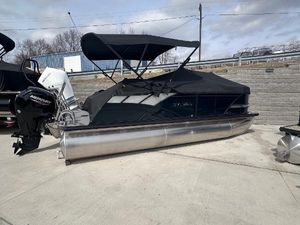 Sylvan Mirage Cruise 8520 CLZ DH 2025 Sylvan Mirage Cruise 8520 CLZ DH pontoon boat with black canopy and Mercury outboard.