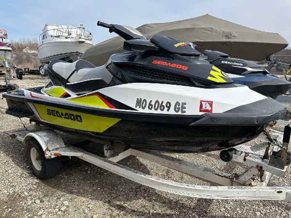 Sea-Doo Wake Pro 215 2015 Sea-Doo Wake Pro 215 jet ski on trailer, parked outdoors.