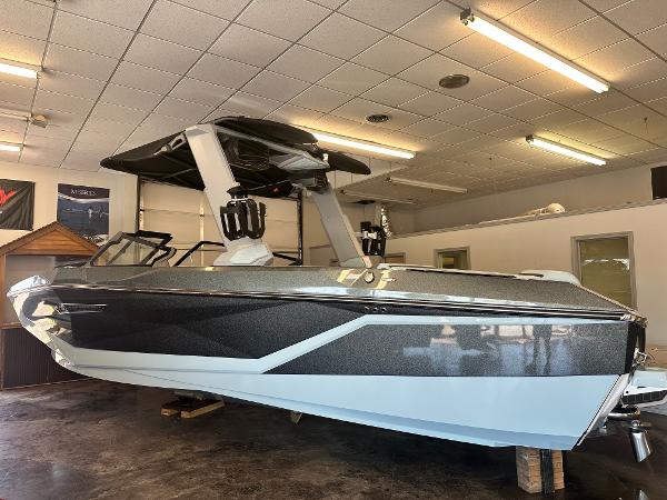 Nautique G25 2025 Nautique G25 boat in showroom, featuring sleek design and modern aesthetics.