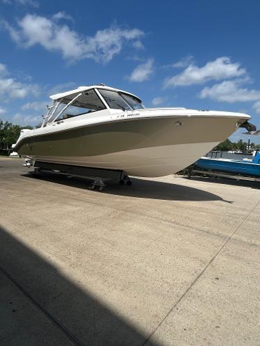 Everglades 340 Dual Console 2020 Everglades 340 Dual Console boat on a sunny day, docked on concrete.
