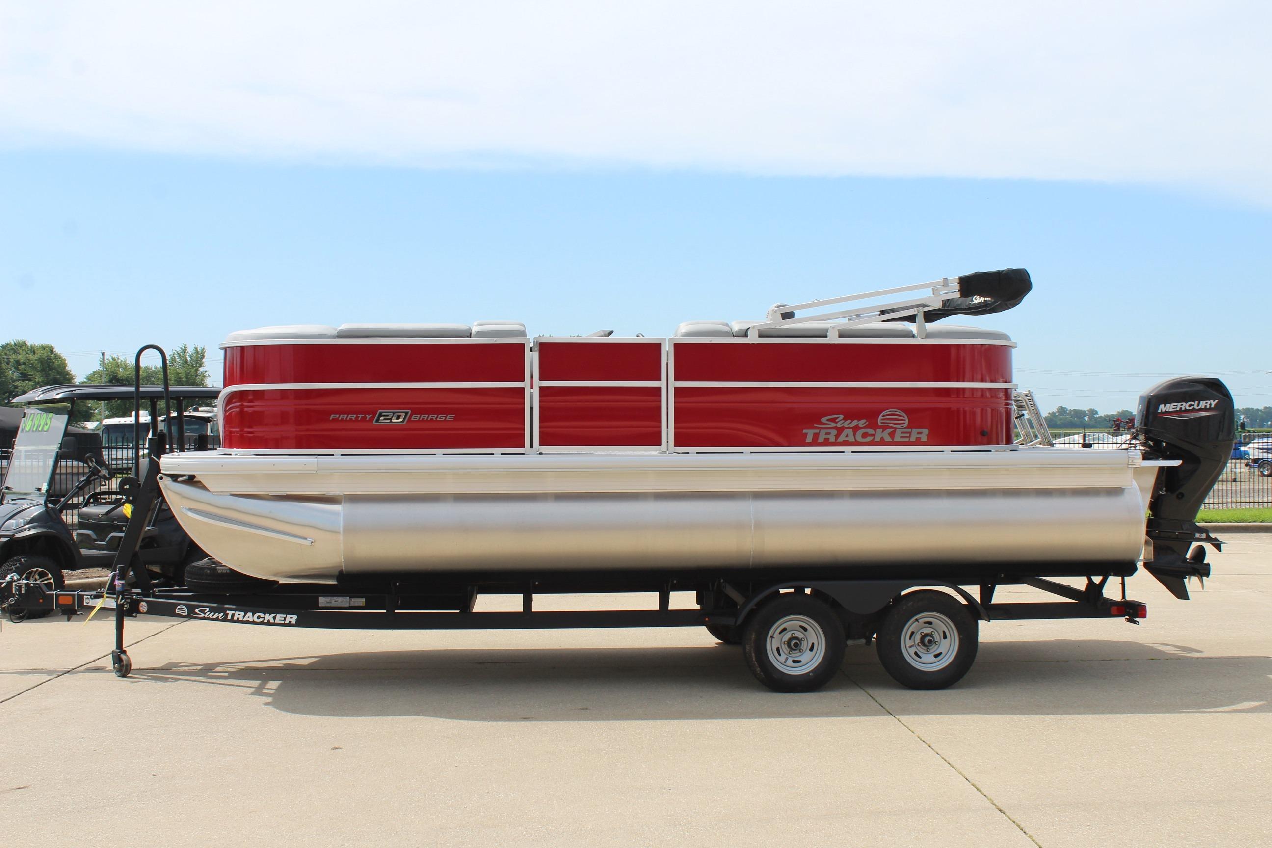 Sun Tracker Party Barge 20 DLX 2026 Sun Tracker Party Barge 20 DLX pontoon boat on trailer, side view.
