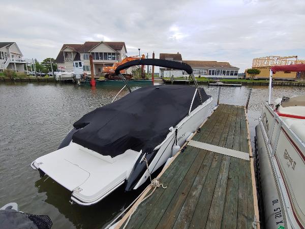 Cobalt R5 2016 Cobalt R5 boat docked at a marina with a black cover.