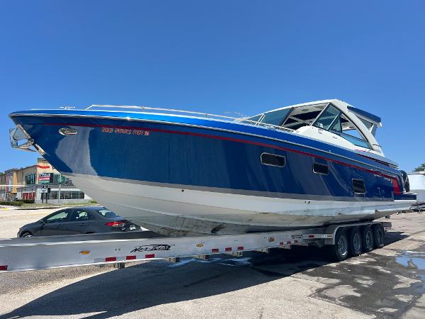 Formula 430 Super Sport Crossover 2017 Formula 430 Super Sport Crossover boat on trailer under clear blue sky.
