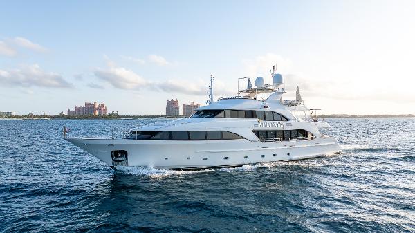 Benetti Classic 2008 Benetti Classic yacht cruising on open water, with a scenic coastal backdrop.
