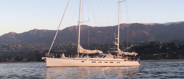 Custom Kelly Archer Sailing yacht "Kelly Archer" 1998 on calm waters with mountainous backdrop.