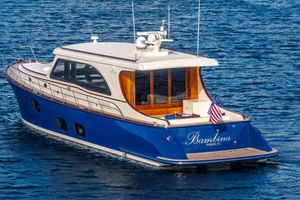 Vicem 65 Classic 2025 Vicem 65 Classic yacht on blue water, rear view with American flag.