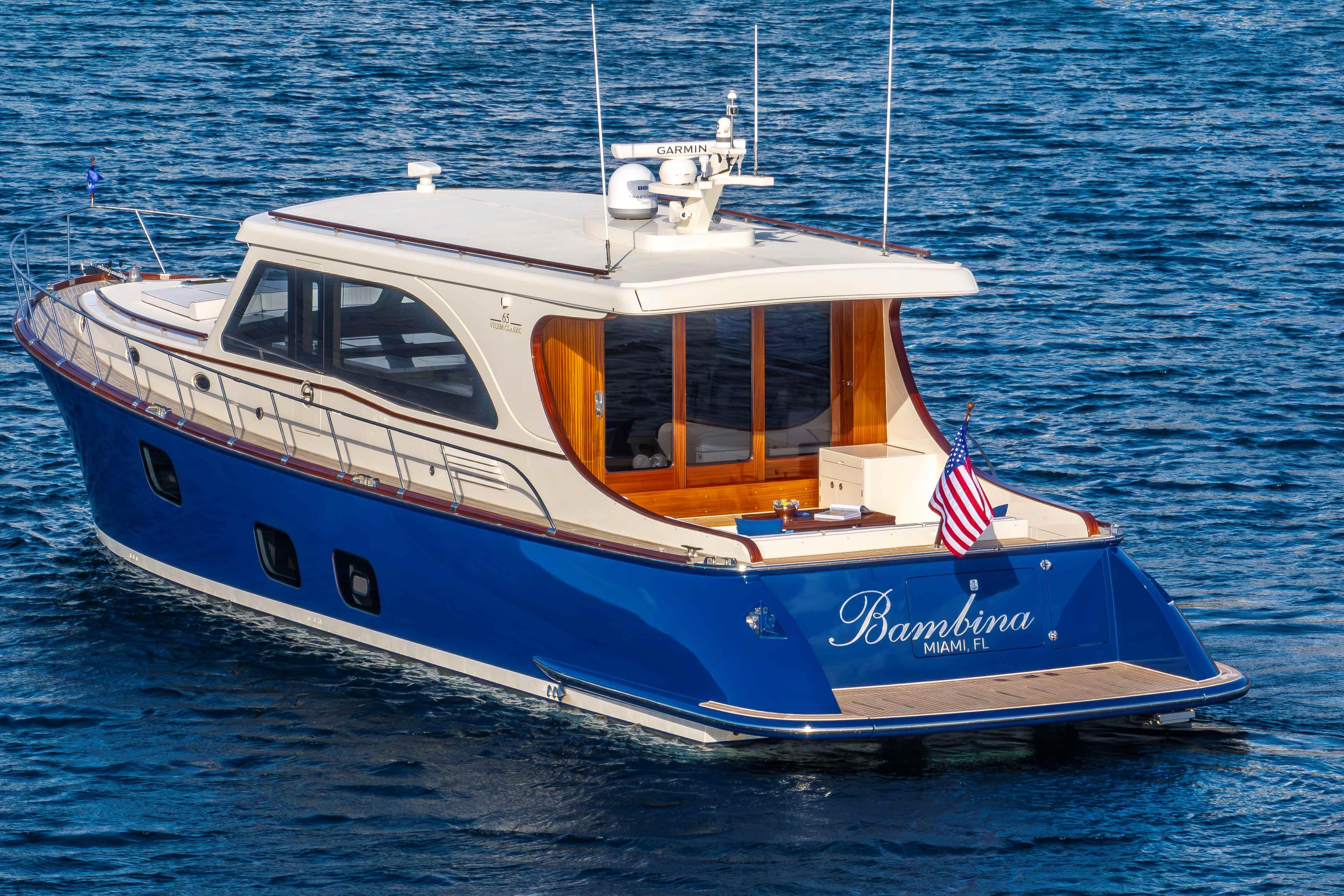 Vicem 65 Classic 2025 Vicem 65 Classic yacht on blue water, rear view with American flag.