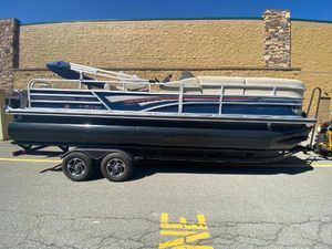 Ranger Reata 220FC 2023 Ranger Reata 220FC pontoon boat on trailer, parked outdoors.