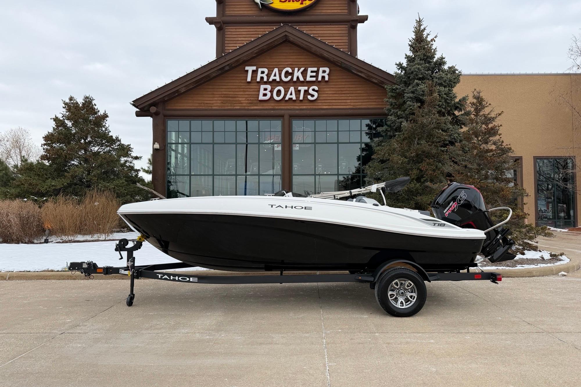 Tahoe T18 2026 Tahoe T18 boat on trailer outside Tracker Boats dealership.