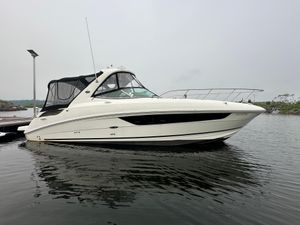 Sea Ray Sundancer 310 2017 Sea Ray Sundancer 310 yacht docked on calm water.