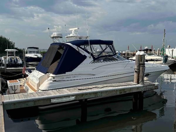 Regal Commodore 3560 IO 2006 Regal Commodore 3560 IO yacht docked at marina under cloudy sky.