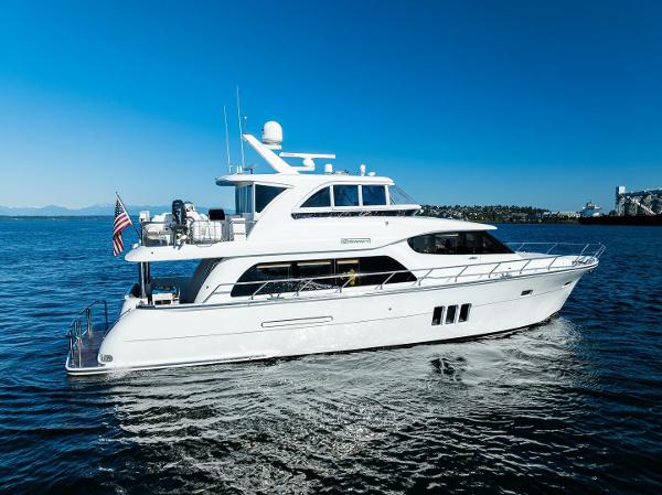 Regency P65 2017 Regency P65 yacht cruising on open water under clear blue skies.