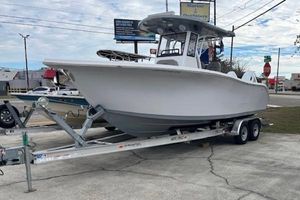 Sea Pro 262 Deluxe CC 2024 Sea Pro 262 Deluxe CC boat on trailer, parked outdoors.