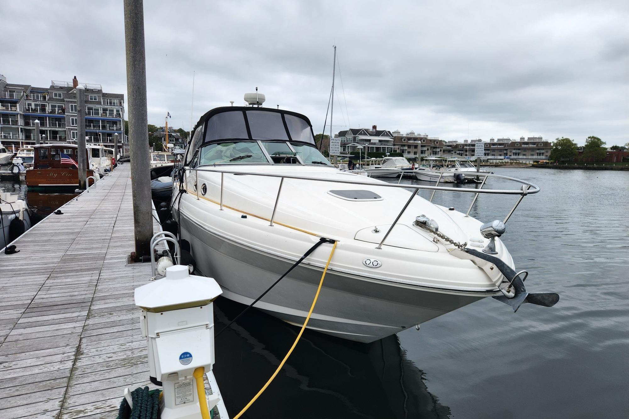 Sea Ray 340 Sundancer 2003 Sea Ray 340 Sundancer docked at a marina, overcast sky.