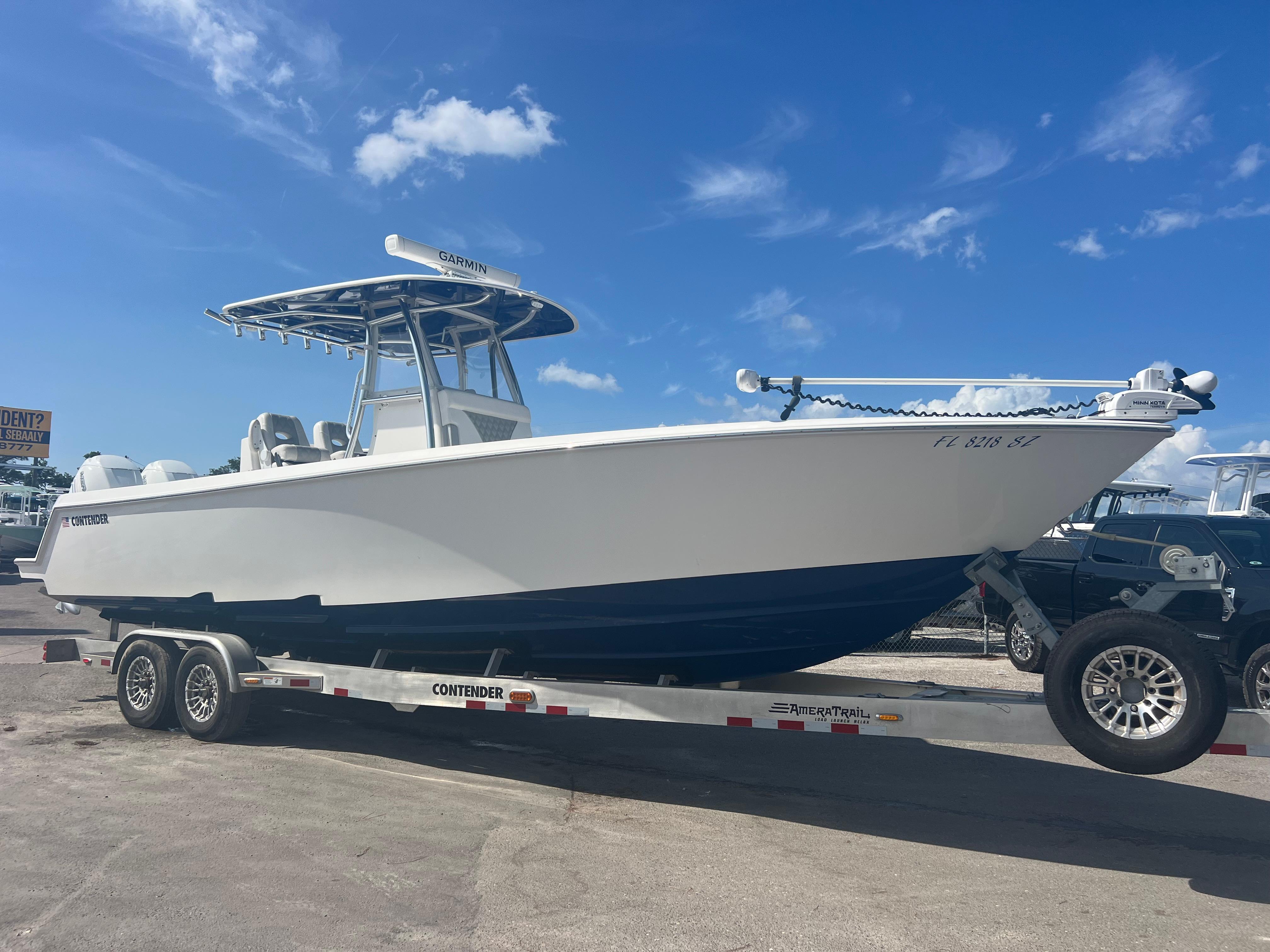 Contender 32 ST 2021 Contender 32 ST boat on trailer under clear blue sky.