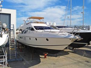 Azimut 62 2005 Azimut 62 yacht on dry dock, showcasing sleek design and luxury features.