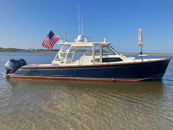 Marlow Prowler Havana 375 2018 Marlow Prowler Havana 375 boat with American flag on calm water.