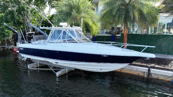 Intrepid 348 Walkaround 2005 Intrepid 348 WA boat docked near palm trees.
