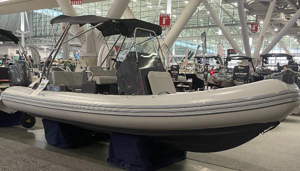 Zodiac Medline 5.8 2025 Zodiac Medline 5.8 inflatable boat displayed at an indoor boat show.