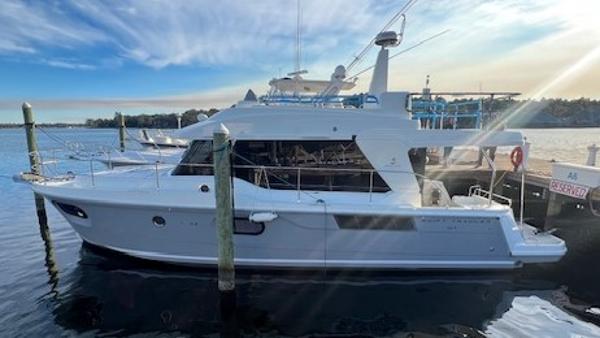 Beneteau Swift Trawler 41 Fly 2022 Beneteau Swift Trawler 41 Fly docked on a sunny day.