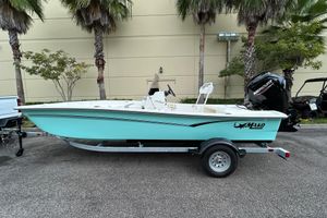 Mako Pro Skiff 17 CC 2026 Mako Pro Skiff 17 CC boat on trailer, parked outdoors.