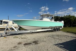 Contender 39 Fisharound 2023 Contender 39 Fisharound boat on trailer under clear blue sky.