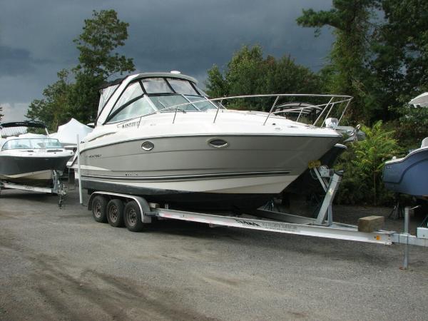 Monterey 280 Sport Yacht 2013 Monterey 280 Sport Yacht on trailer, parked outdoors under cloudy skies.