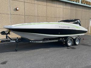 Tahoe 2150 2024 Tahoe 2150 boat on trailer, sleek design, parked outdoors.